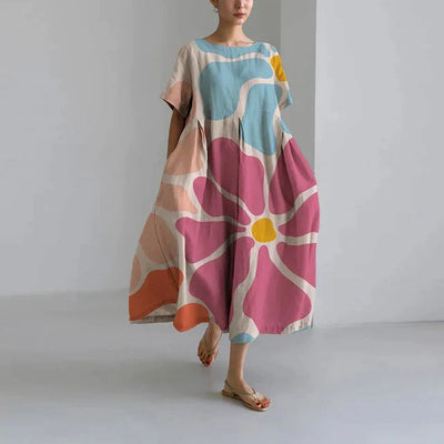 https://cdn.shopify.com/s/files/1/0741/0774/8619/files/robe-longue-verte-fleurs-multicolores.webp?v=1726495667